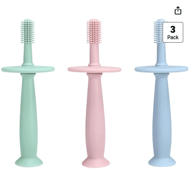 Three tube-style silicone baby toothbrushes in mint, pink, and blue